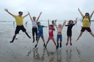 Wembury Beach Summer Holiday Club children jumping