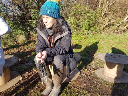 Former Wild Paths trainee sarah sitting in circle on school grounds