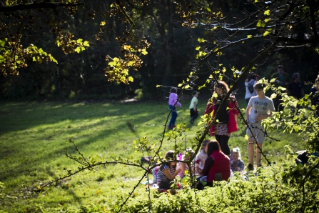 Families playing in a Plymouth green space as part of an Active Neighbourhoods event 