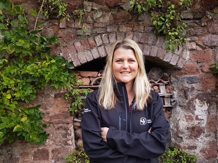 Louise Sullivan looking at camera in garden